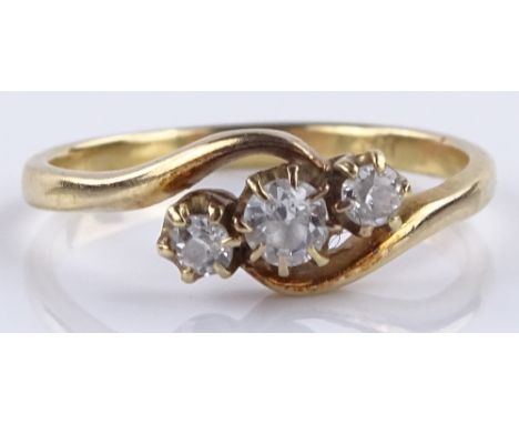 An 18ct gold 3-stone diamond crossover ring, setting height 6.7mm, size O, 2.7g