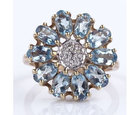 An unmarked gold blue topaz and diamond flowerhead cluster ring, setting height 16.9mm, size M, 3.7g