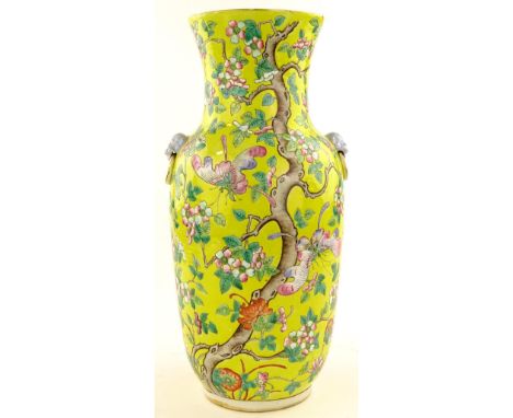 A Chinese yellow ground porcelain vase, hand painted enamel butterflies and prunus, lion ring handles, height 45cm 