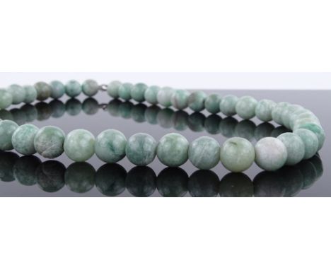 A string of polished Burmese jade beads, overall length 570mm