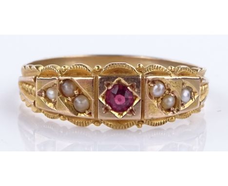 An unmarked gold ruby and seed pearl set ring, setting height 6.8mm, size R, 3g