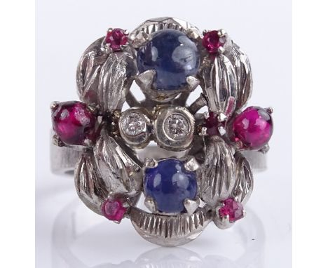 An 18ct white gold ruby and sapphire cluster cocktail ring, setting height 18.4mm, size K, 6.4g