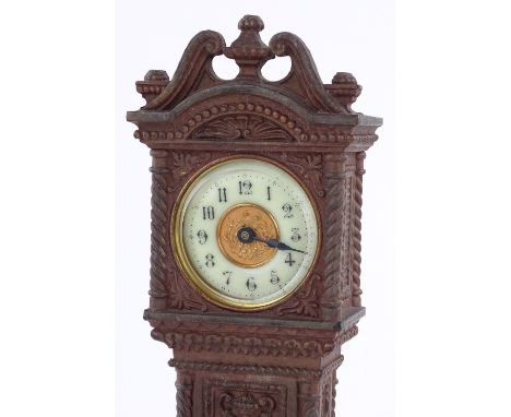 A Victorian cast-metal cased miniature longcase clock, with enamel dial, circa 1900, and relief embossed case, height 29cm