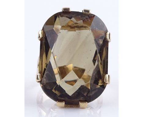 A large 9ct gold smokey quartz ring, setting height 26.6mm, size M, 12.3g