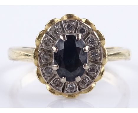 An 18ct gold sapphire and diamond oval cluster ring, setting height 13mm, size Q, 5.7g