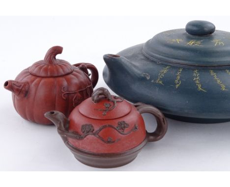 A large Chinese Yixing pottery teapot with incised text, diameter 25cm, and 2 smaller Yixing teapots (3)