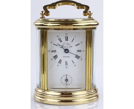 A modern Garrard oval brass cased carriage clock, with 8-day movement, case height 11.5cm