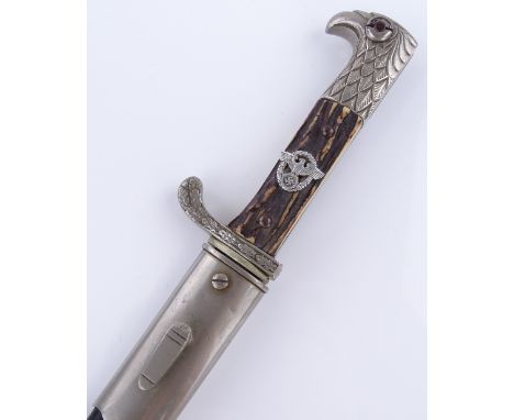 A German bayonet / dagger with horn grips and nickel and leather scabbard