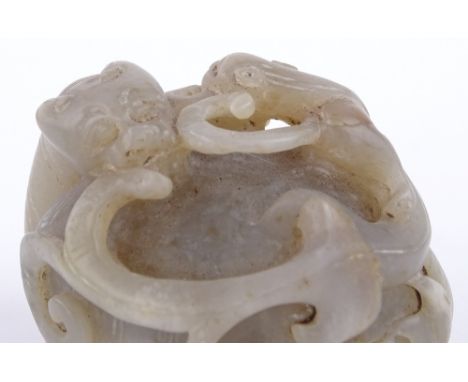 A Chinese pale jade carving of fighting dragons, length 6cm