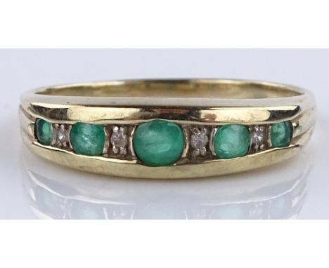 An 18ct gold 9-stone emerald and diamond ring, setting height 5.1mm, size P, 2g