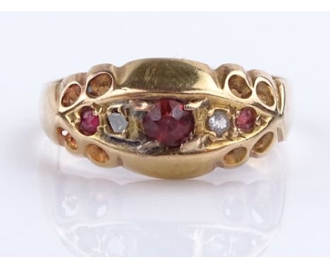 An 18ct gold 5-stone garnet and diamond ring, setting height 7.7mm, size K, 2.4g (smaller gems chipped)