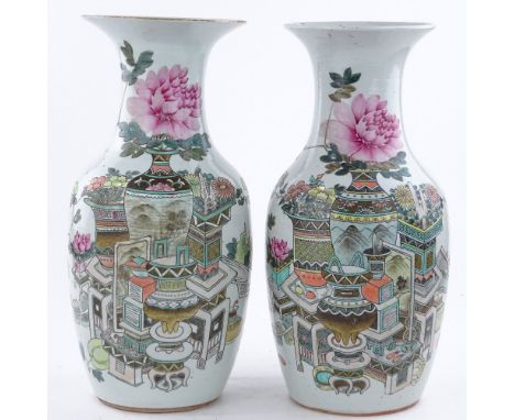 A pair of Chinese porcelain vases with painted ceramic designs, height 44cm