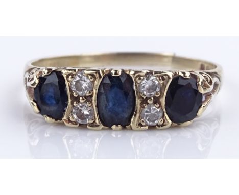 A 9ct gold 7-stone sapphire and diamond ring, scroll engraved bridge, setting height 6.2mm, size W, 3g (band A/F)