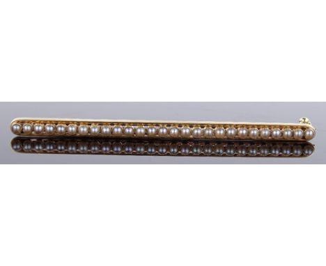 A Victorian 15ct gold seed pearl set line bar brooch, length 64.7mm, 4.6g