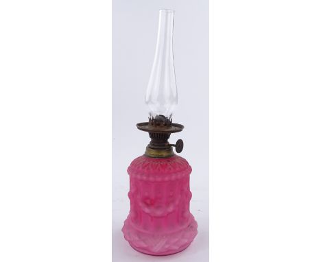 A Victorian moulded pink satin-glass oil lamp, height including chimney 26cm