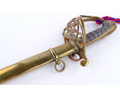 A Victorian military dress sword, pierced brass basket hilt with shagreen grips, original brass scabbard