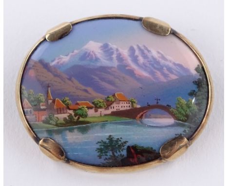 An oval enamel brooch, depicting Mount Rossel Bautte, St Martin, 9ct gold frame, length 35.1mm