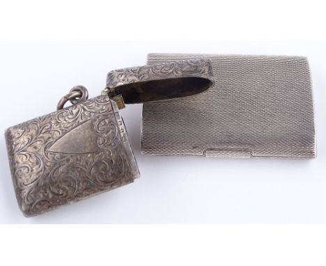 An engine-turned silver matchbook case and an engraved silver Vesta case (2)