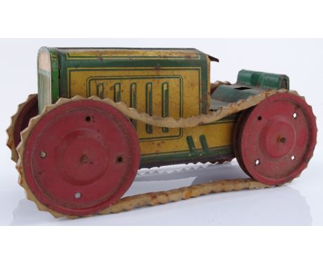 A tinplate clockwork tractor, length 22cm.