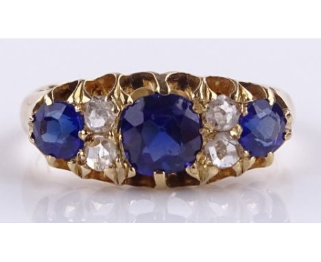 An 18ct gold 7-stone sapphire and diamond ring, setting height 7.4mm, size K, 3.5g