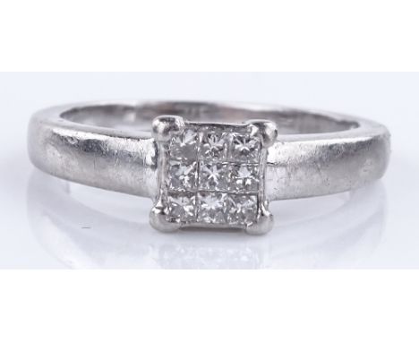 A platinum and Princess-cut diamond cluster ring, total diamond content approx. 0.25cts, setting height 6.2mm, size L, 5.1g.