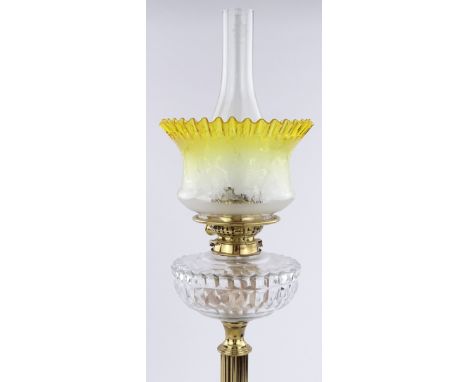 A Victorian brass and cut-glass oil lamp with frilled yellow edged glass shade, height 59cm