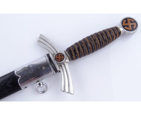 A German dagger with leather-mounted scabbard