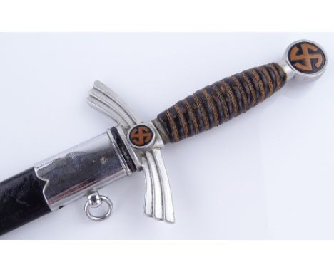 A German dagger with leather-mounted scabbard