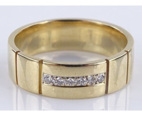 A 14ct gold diamond set band ring, setting height 5.8mm, size P, 6.3g