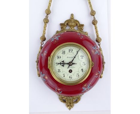 An ornate French brass and ceramic cased wall-hanging clock, with enamel dial signed Aitchison of London and Paris, with 8-da