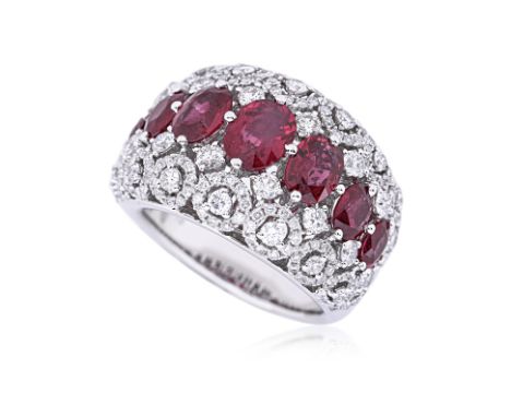 A RUBY AND DIAMOND RING Featuring seven rubies totalling approximately 3.67 Cts (marked), with the biggest estimating above 1