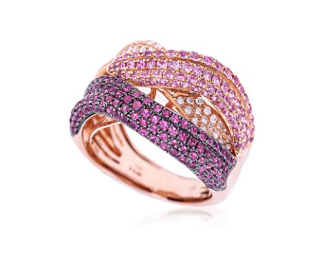 A RUBY, PINK SAPPHIRE AND DIAMOND CROSSOVER RING Featuring round cut rubies and pink sapphires weighing approximately 1.30 Ct