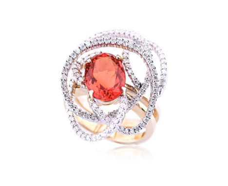 A FIRE OPAL AND DIAMOND RING Featuring an oval cut fire opal weighing approximately 2.40 Cts, mounted in an 18K mixed gold se