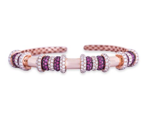 A RUBY AND DIAMOND CUFF BANGLE Featuring round brilliant cut rubies totalling approximately 1.50 Cts, mounted in an 18K mixed