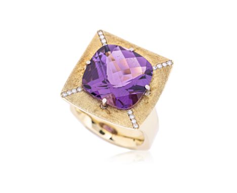 AN AMETHYST AND DIAMOND RING Featuring a checkered cut amethyst weighing approximately 11.0 Cts, mounted in an 18K yellow gol