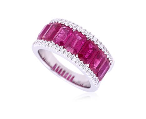 A RUBY AND DIAMOND BAND Featuring seven emerald cut rubies totalling approximately 3.45 Cts (marked), mounted in an 18K white