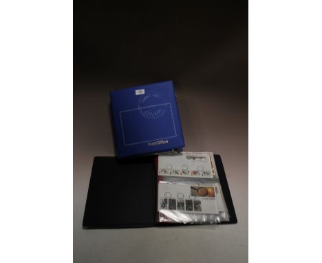 TWO FOLDERS OF FIRST DAY COVERS PLUS A TIN OF CIGARETTE CARDS
