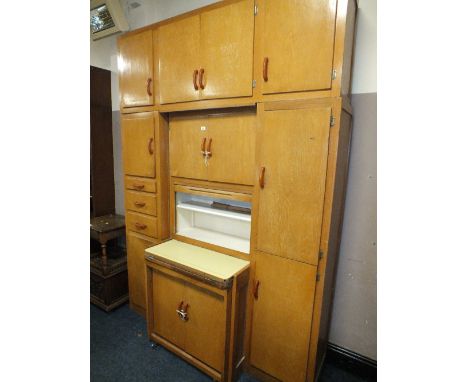 A LARGE VINTAGE LIGHT OAK KITCHEN CABINET 