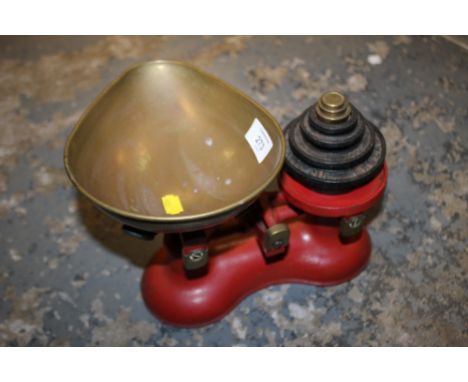 A VINTAGE SET OF SCALES WITH WEIGHTS 