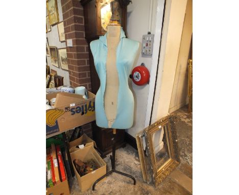 A VINTAGE DRESS MAKERS MANNEQUIN ON METAL STAND 