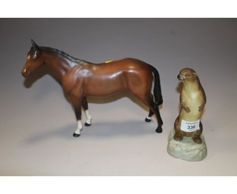 AN AYNSLEY FIGURE OF AN OTTER TOGETHER WITH A BESWICK RACEHORSE (2)