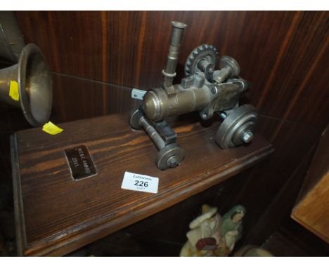 A MODEL STEAM TRACTION ENGINE BUILT OUT OF CAR PARTS 