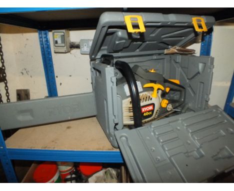 A CASED RYOBI CHAINSAW