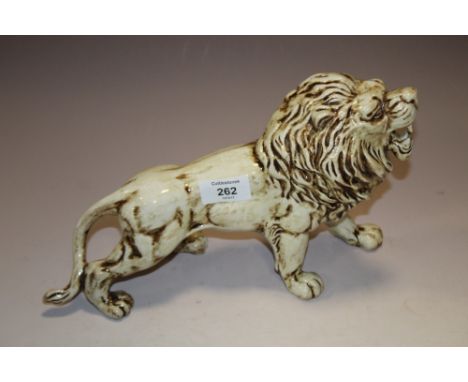 A BRETBY CERAMIC FIGURE OF  A LION 
