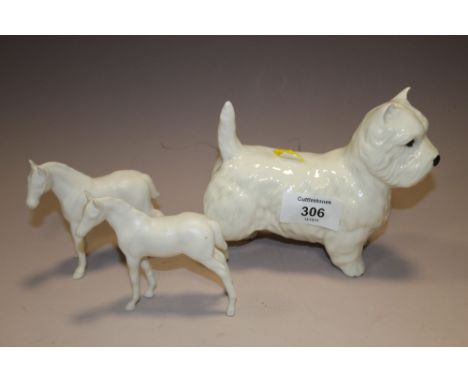 A WHITE BESWICK TERRIER FIGURE TOGETHER WITH TWO WHITE MATTE FINISH BESWICK FOAL FIGURES A/F