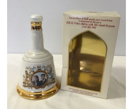 A boxed Bells whisky decanter sealed with contents (750ml) commemorating the Royal wedding of Prince Andrew & Sarah Ferguson.