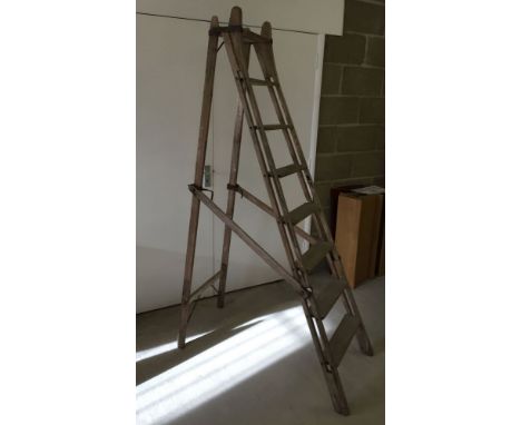 A vintage pitch pine step ladder.