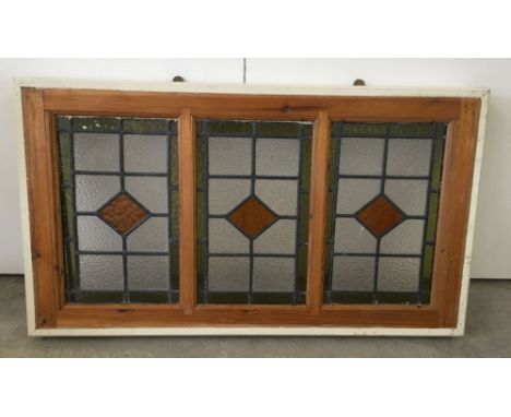 3 vintage lead light windows framed together.