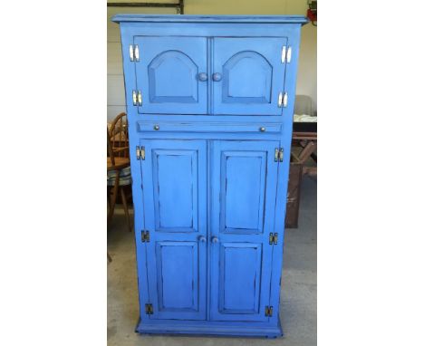 A blue painted pine drinks cabinet with wine rack below and pull-out shelf. 155cm tall, 76cm wide & 43cm deep.