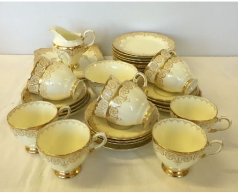 A Tuscan china 'Plant' part tea set comprising 2 sandwich plates, 11 tea plates, 10 cups, 12 saucers, milk jug & sugar bowl (